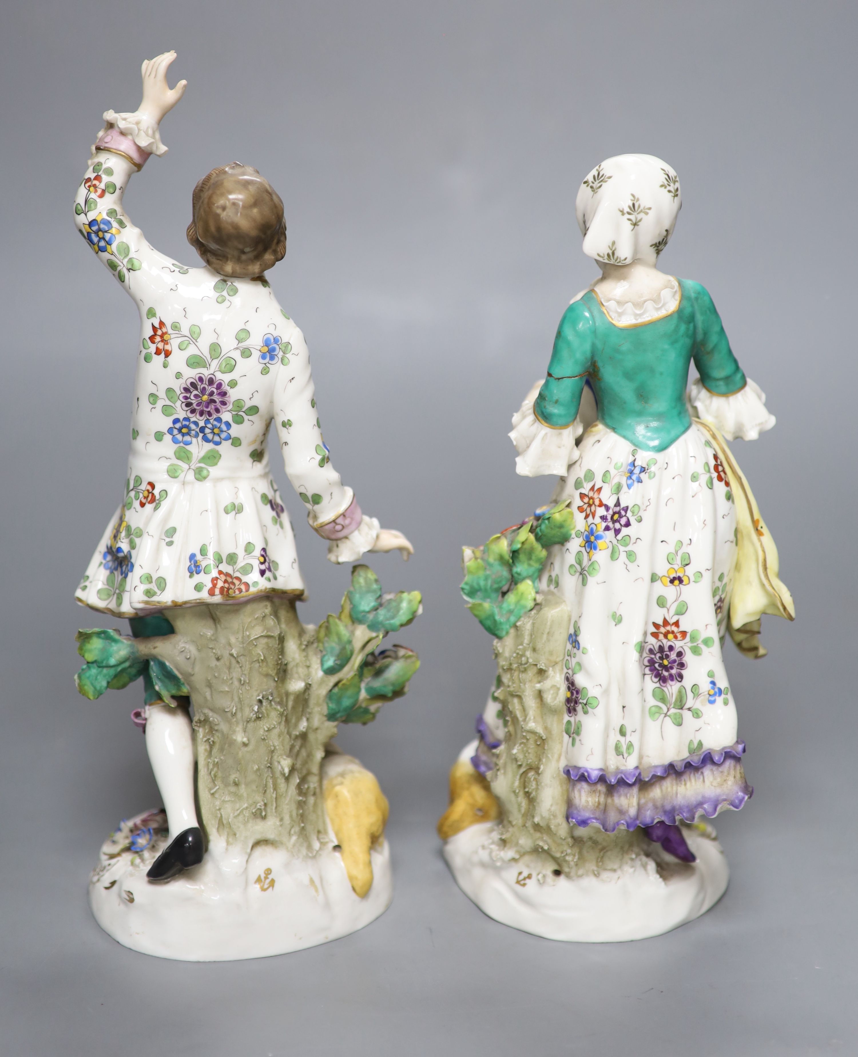 A pair of Continental figurines, height 27cm